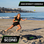 woman catching rampshot ball on a beach