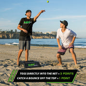 two friends playing rampshot next to ramp on a beach